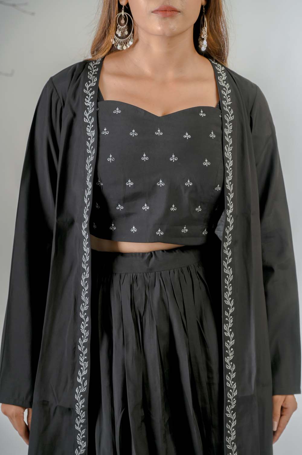 Black Silk Lehenga set for weddings with Silver Zari Jacket - Closeup | Oopnik